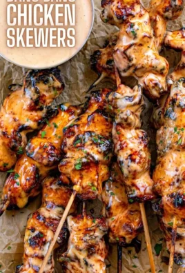 Delicious Bang Bang Chicken Skewers served on a platter
