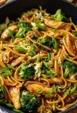 Gluten-free chicken lo mein served with colorful vegetables