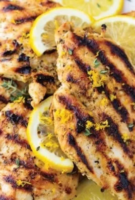 Delicious lemon marinade for chicken in a bowl with fresh herbs