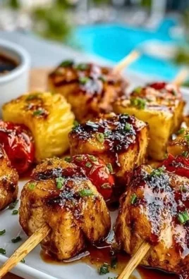 Delicious pineapple chicken kabobs on a grill with vibrant vegetables.