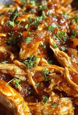 Delicious pulled BBQ chicken made in a Crock Pot, perfect for meals.