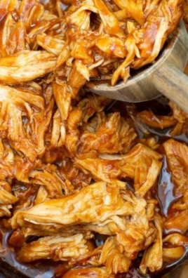Delicious slow cooker BBQ chicken served with a side of coleslaw
