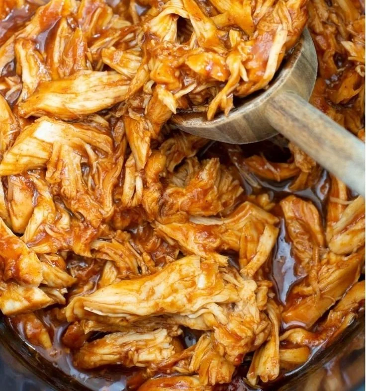 Delicious slow cooker BBQ chicken served with a side of coleslaw