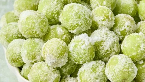 Bowl of 3-ingredient frozen candied grapes ready to enjoy