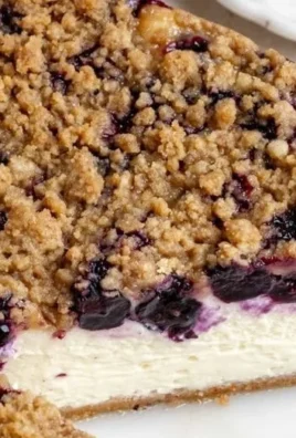 Delicious slice of blueberry cheesecake topped with fresh blueberries