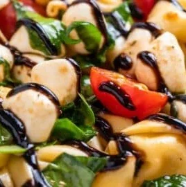 Delicious Caprese Tortellini Salad with tomatoes and mozzarella