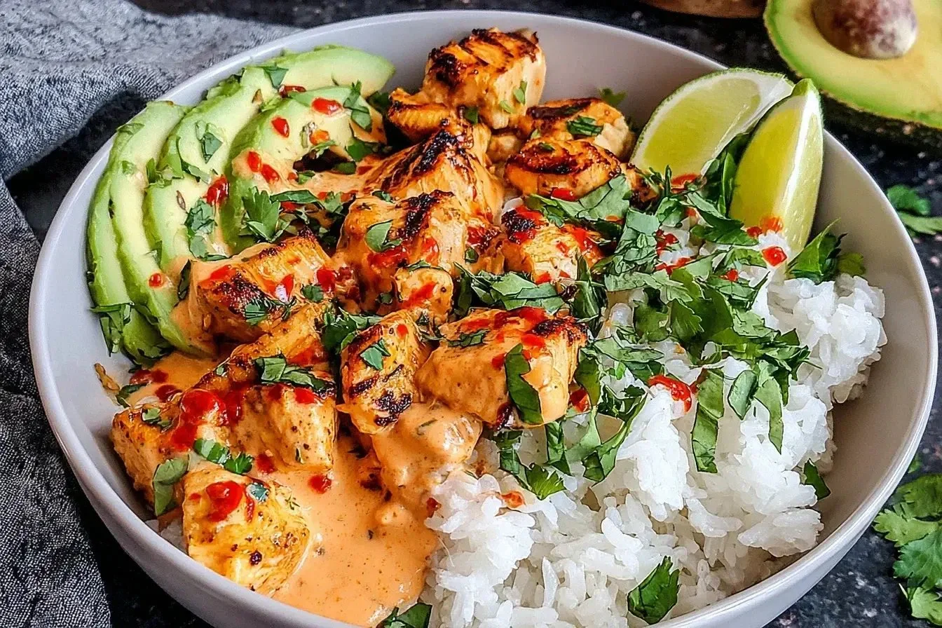 Delicious Coconut Chicken Rice Bowl with chicken, coconut rice, and vibrant toppings.