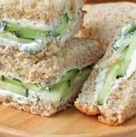 Delicious cucumber sandwiches served on a platter for a tea party.