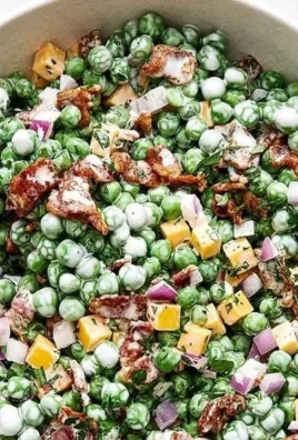 Bowl of easy cold pea salad with bacon, a refreshing summer dish