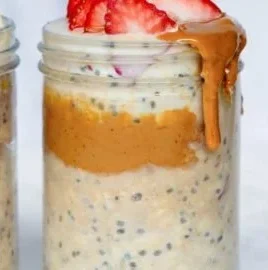 Bowl of high-protein overnight oats topped with fruits and nuts