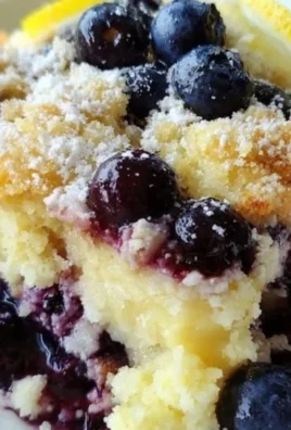 Delicious lemon blueberry cheesecake dump cake with fresh blueberries and lemon zest.