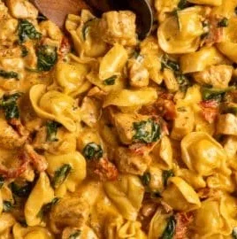 Marry Me Chicken Tortellini dish featuring creamy sauce and fresh herbs
