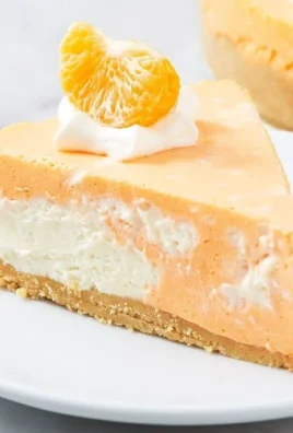 Delicious No-Bake Creamsicle Cheesecake with orange topping and crust