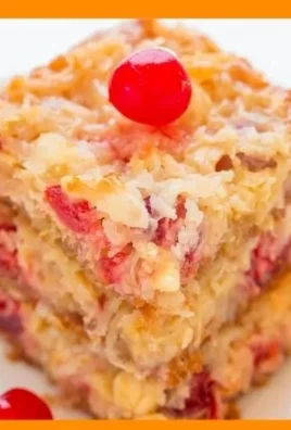 Delicious No-Mixer Piña Colada Bars topped with coconut and pineapple slices.