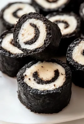 Oreo sushi rolls made with crushed Oreos and rice, a delightful dessert treat.
