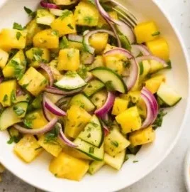 Pineapple Cucumber Salad served in a bowl with fresh ingredients and vibrant colors.