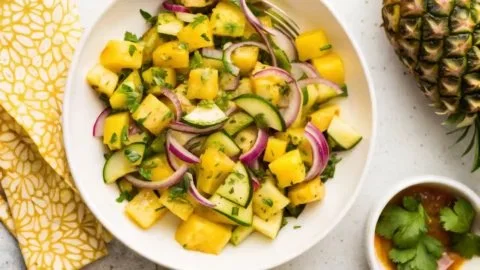 Pineapple Cucumber Salad served in a bowl with fresh ingredients and vibrant colors.