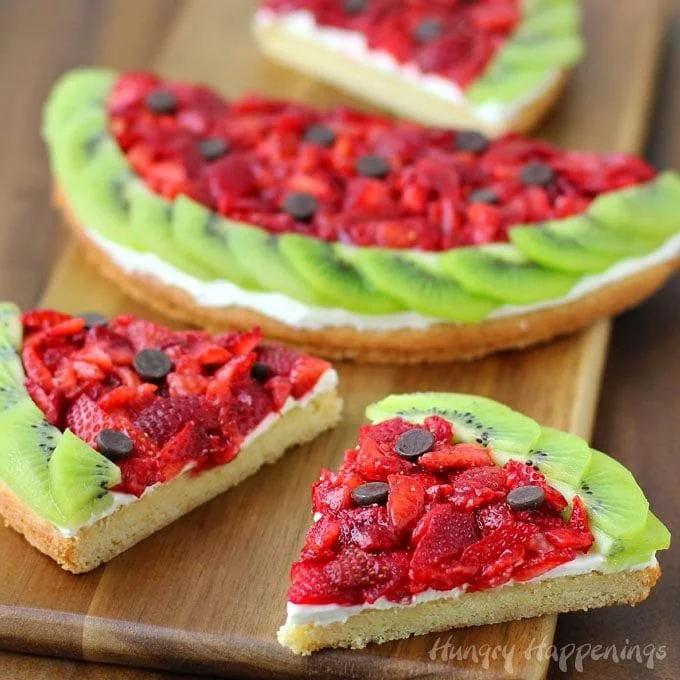 Strawberry Kiwi Fruit Pizza served on Watermelon with vibrant toppings