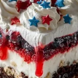 Colorful 4th of July dessert lasagna with red, white, and blue layers
