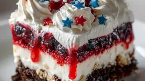 Colorful 4th of July dessert lasagna with red, white, and blue layers