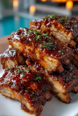 Delicious Baked Southern Roadhouse Ribs served with barbecue sauce.