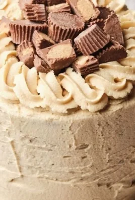 Bakery-style chocolate cake with peanut butter frosting on a decorative plate