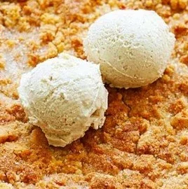 Bourbon Peach Cobbler dessert with fresh peaches and bourbon sauce.