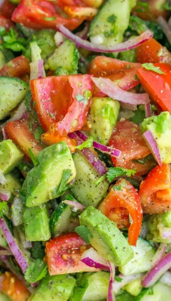 Cucumber Tomato Avocado Salad with fresh ingredients in a bowl