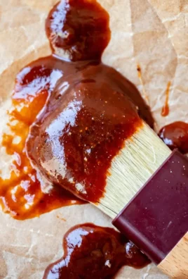 Homemade easy BBQ sauce in a jar with fresh ingredients.