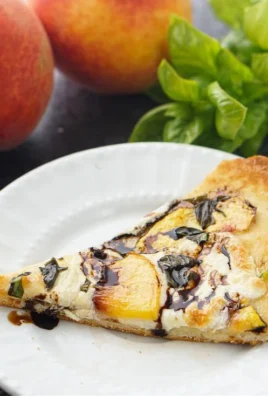 Easy Peach Basil Naan Bread Pizza topped with fresh peaches and basil