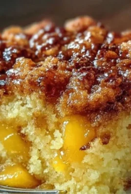 Delicious easy peach cobbler freshly baked and served in a dish