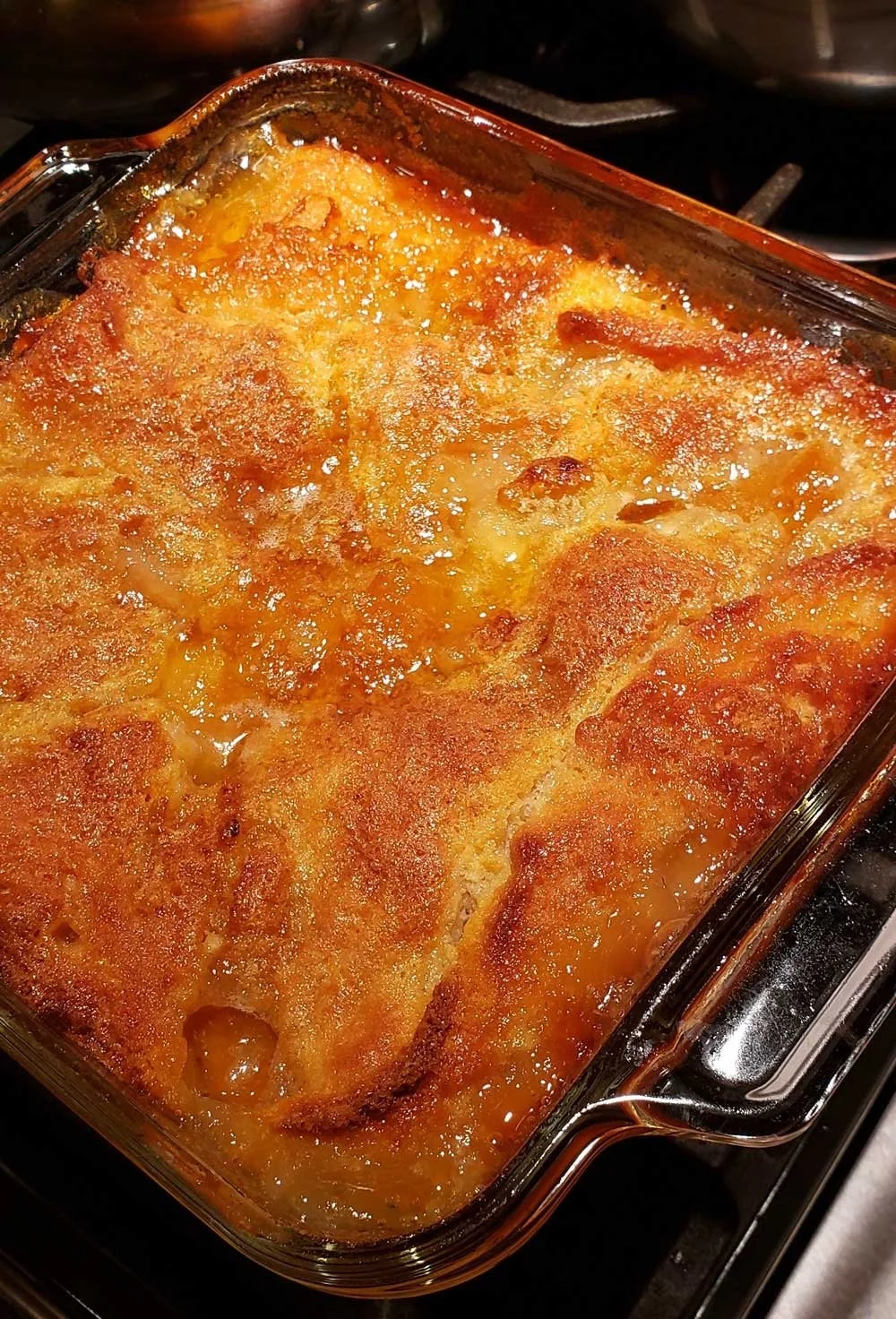 Deliciously baked easy peach cobbler topped with golden crust