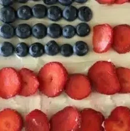 Flag Fruit Sugar Cookie Pizza topped with vibrant fresh fruits