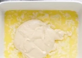 Fresh and delicious peach dessert served in a bowl with cream