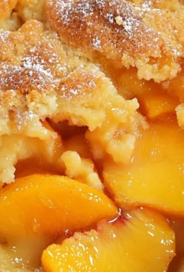 Delicious Georgia peach cobbler served warm with ice cream