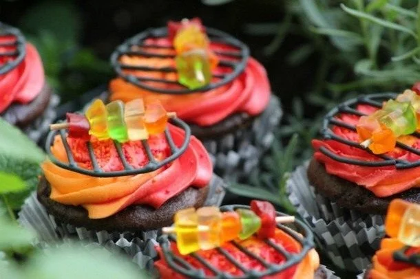 Delicious grill cupcakes served on a platter, decorated with colorful frosting.