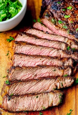 Juicy grilled ribeye steak on a plate, perfect for Father's Day dinner.