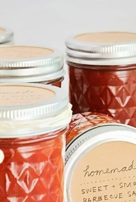 Delicious homemade barbecue sauce in a mason jar with fresh ingredients