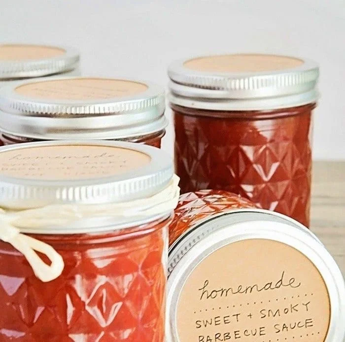 Delicious homemade barbecue sauce in a mason jar with fresh ingredients