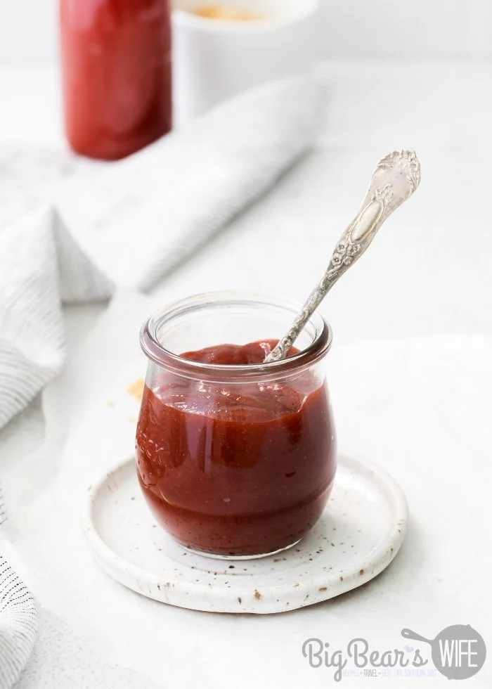 Homemade brown sugar BBQ sauce in a jar with fresh ingredients