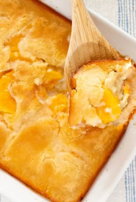 Delicious homemade peach cobbler with golden crust and juicy peaches