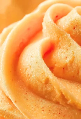 Bowl of delicious fresh peach sorbet served with fresh peach slices