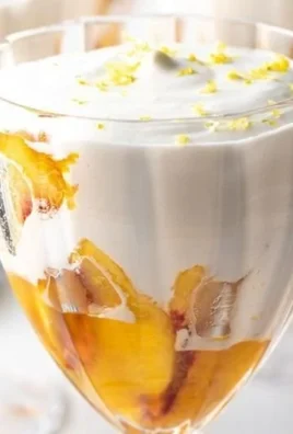 No-Bake Peaches and Cream dessert garnished with fresh peaches