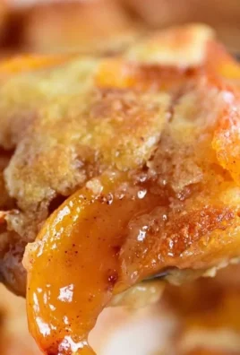Homemade peach cobbler with fresh peaches and golden crust