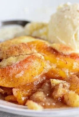 Delicious homemade Peach Cobbler ready to serve with a golden crust.