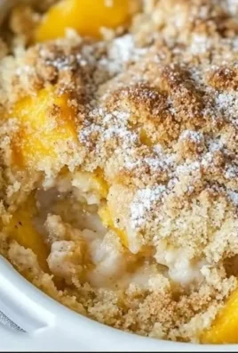 Delicious homemade peach cobbler topped with crispy crust and juicy peach filling.