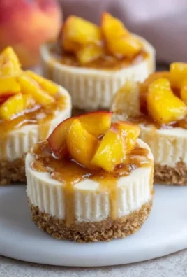 Peach Cobbler Mini Cheesecakes served on a decorative platter