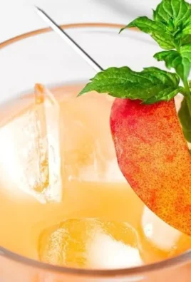 A delicious Peach on the Beach Cocktail garnished with fresh peaches.