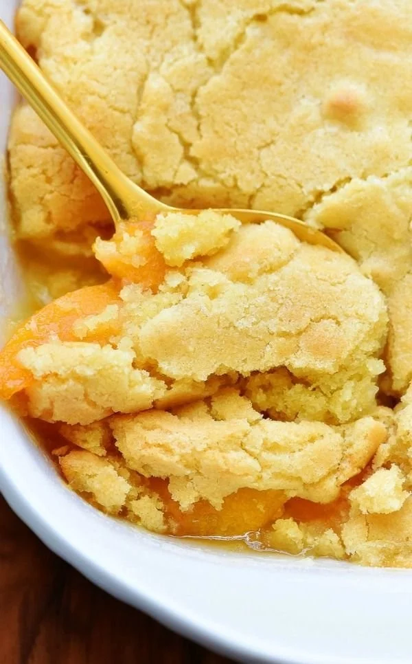 Delicious peach cobbler with a golden crust and fresh peaches.