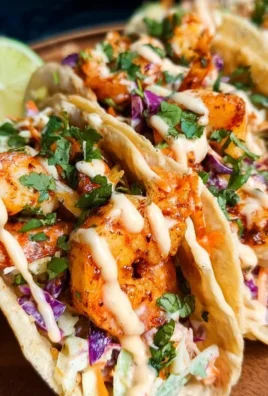 Delicious shrimp tacos served in a taco shell with fresh ingredients